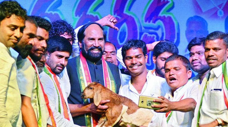 Telangana Pradesh Congress Committee president Uttam Kumar Reddy poses for a selfie with party activists at Jana Garjana meeting at Jedcherla in Mahbubnagar district on Wednesday. (Photo: DC)