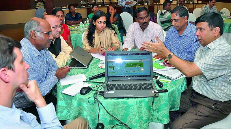 Principal secretary Ajay Jain interacts with officials at Indo-Swiss building energy efficiency project organised by CRDA and Department of Energy in Vijayawada on Wednesday. (Photo: DC)