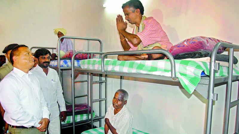 Prisons director V.K. Singh interacts with footpath dwellers at the Anand Ashram in Chanchalguda on Monday. (Photo: DC)
