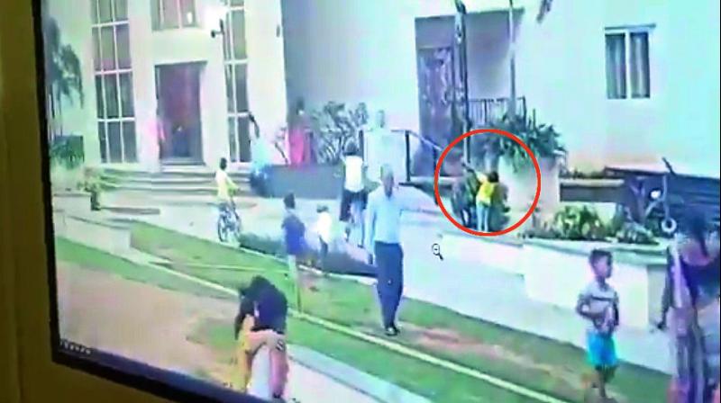 CCTV footage shows the boy getting electrocuted when he attempts to swing around a lamp post, at the lawn area at PBEL City on Monday evening.