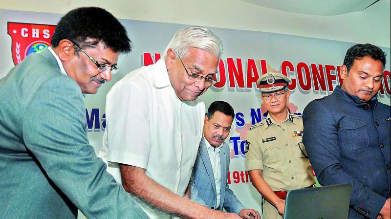 DGP N. Sambasiva Rao and retired IAS officer K. Padmanabhaiah jointly release a website at the workshop on â€œMapping Indias security challengesâ€ in Vijayawada on Monday. (Photo: DC)