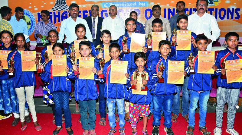 Prize winners of the 1st Mahaveer Trophy All India Open Fide rating chess tournament pose with their trophies. The tournament was recently played at Mahaveer Engineering College in Bandlaguda, Hyderabad.