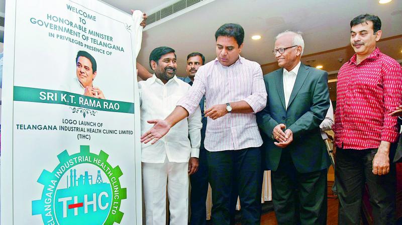 Minister K.T. Rama Rao unveils the Telangana Industrial Health Clinic Limited logo at Tourism Plaza on Monday. Minister Jagadeeswar Reddy and others are also seen.  (Photo: Deccan Chronicle)