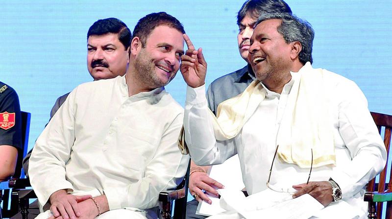 Congress vice-president Rahul Gandhi and Karnataka CM Siddaramaiah in Bengaluru on Monday. (Photo: PTI)