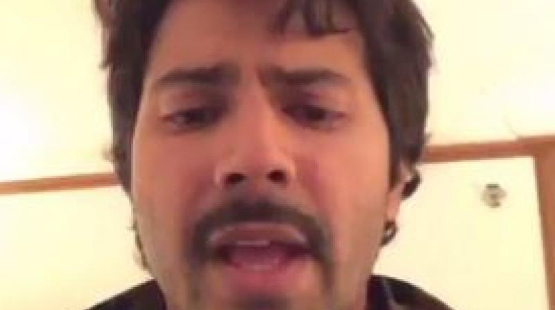 A screenshot from Varun Dhawans video of him singing Theher Ja.