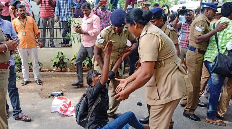 Policewomen attempt to remove a protester from the CBSE office premises (Photo: DC)