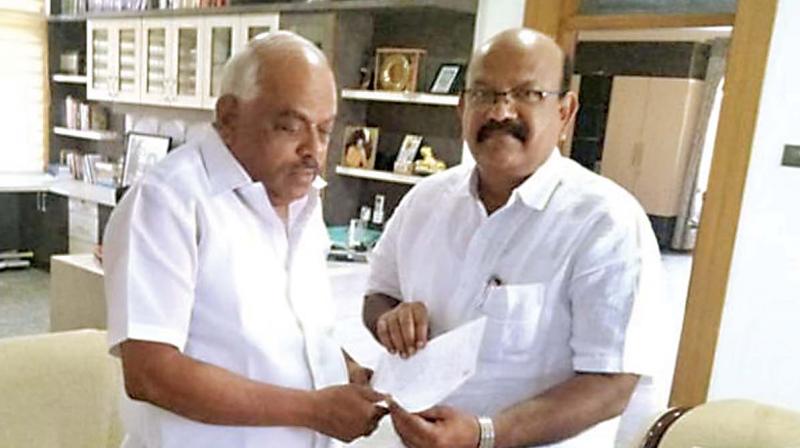 Congress MLA Umesh Jadhav submits his resignation letter to Speaker Ramesh Kumar in Bengaluru on Monday.