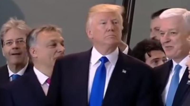 Video: Donald Trump pushes aside Montenegro PM Markovic to get in front