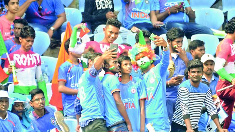 Young cricket enthusiasts take a selfie during the second ODI between India and West Indies at the ACA-VDCA Stadium in Visakhapatnam on Wednesday. (Photo: DC)