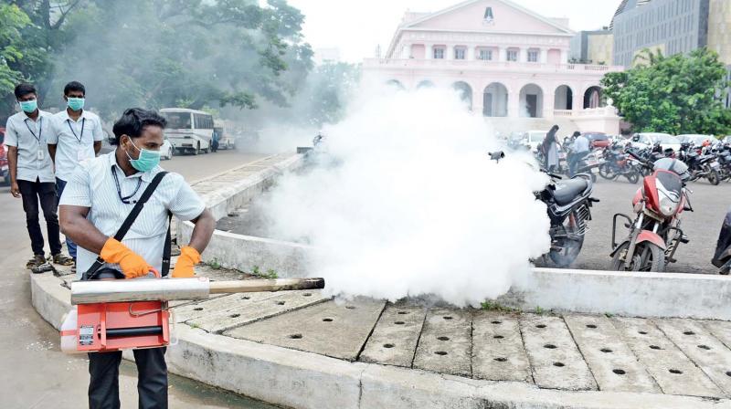 Sanitary workers carry out fogging operations outside Omandurar multi super speciality hospital. (Photo: DC)