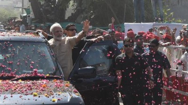 Prime Minister Narendra Modi, on Sunday held a roadshow in Vadnagar, his birthplace, in Mehsana district. (Photo: @PMOIndia/Twitter)