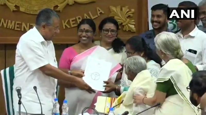 Karthiyani Amma, 96-year-old Kerala woman, who cleared test under state Aksharalaksham literacy program scoring 98 out of 100 marks, was felicitated by CM Pinarayi Vijayan on Thursday. (Photo: Twitter | ANI)