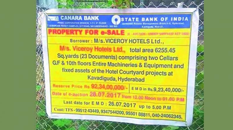 A public notice put up for the sale of a building owned by Viceroy Hotels in the city.