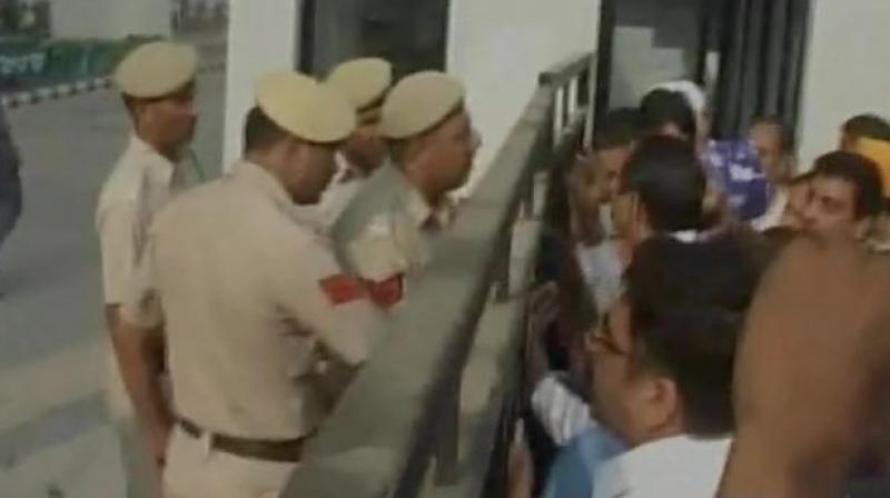 Parents were protesting outside The Millennium School, Panipat after a 9-year-old girl was molested by sweeper. (Photo: ANI | Twitter)  .
