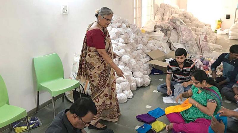 Sudha Murty monitors the packing of relief materials.
