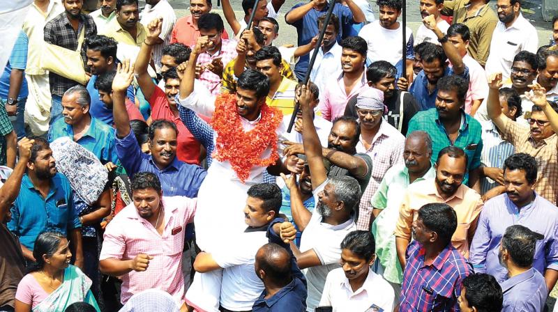 Baiju Thottali is carried by LDF workers after winning the bypoll in Kochi on Friday  Arun Chandrabose