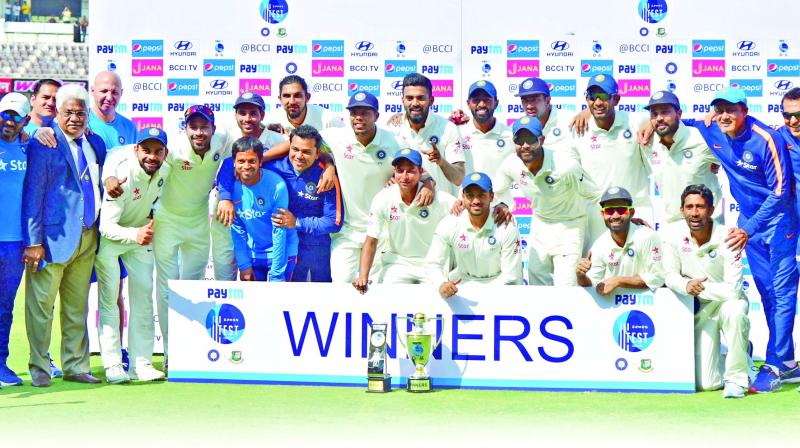 Members of Team India pose with the trophy after beating Bangladesh in the one-off Test.(Photo: S. Surender reddy)