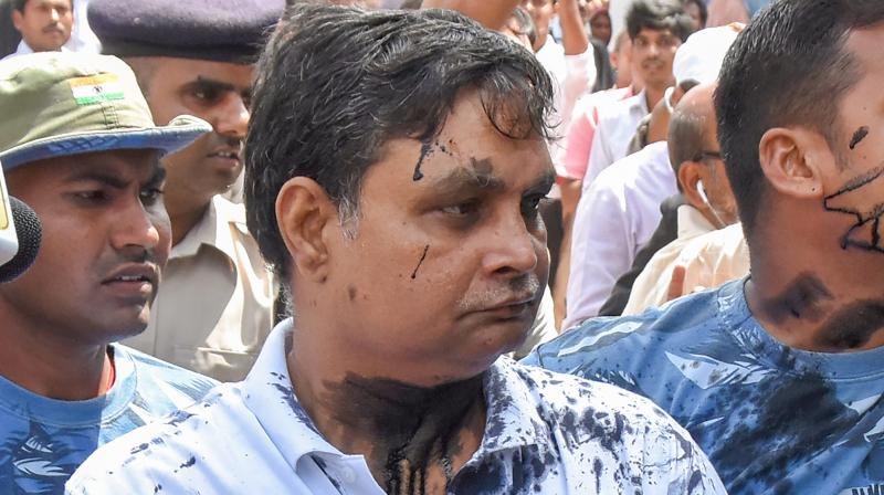 Recently at a court hearing, a woman hurled ink on Brajesh Thajur, main accused in the Muzaffarpur shelter home case. (Photo: PTI)