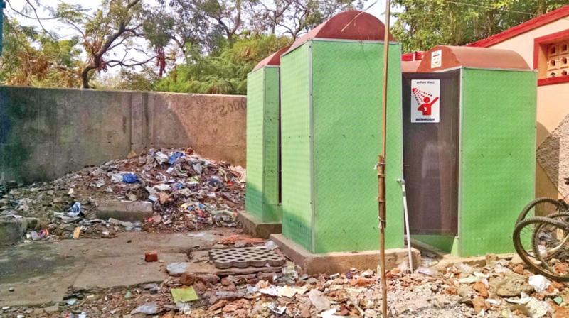 Surrounded by garbage, a public toilet at a fishing village of Besant Nagar remains inaccessible. 	(Photo: DC)