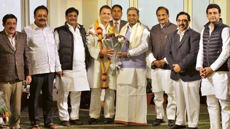 Chief Minister Siddaramaiah greets Rahul Gandhi on his elevation as Congress president in New Delhi on Tuesday.