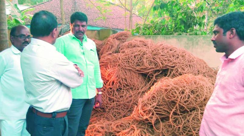 Horticulture officials interact with farmers advising them to use modern machinery to make yarn from coconut husk as, at present, they are using old machinery at Konaseema region. (Photo:  DC)
