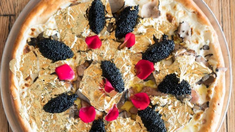 The pizza has white stilton cheese, foie gras, Ossetra caviar, truffles and the gold leaves whiich is recommended if you want to have a lavish meal. (Photo: Instagram)