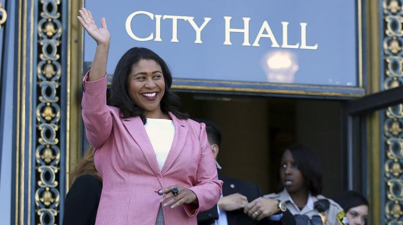 In this June 13, 2018, file photo, London Breed waves before speaking to reporters outside of City Hall in San Francisco. (Photo: AP)