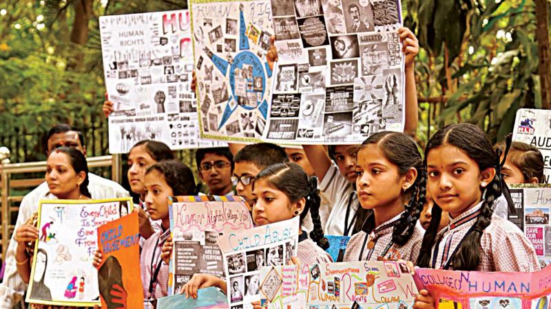 Schoolchildren participate in Human Rights Day celebrations organised by CRISP at Cubbon Park Bengaluru on Saturday. (Inset) Fake encounter victim Venkatesha Bovi (Photo: KPN)