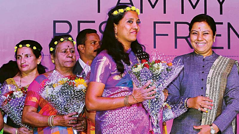 Actor and politician Tara Anuradha with cancer survivors during Fashion Show by Cancer Survivors event to spread awareness about breast cancer, organised by BGS Global Hospitals, in Bengaluru on Saturday.