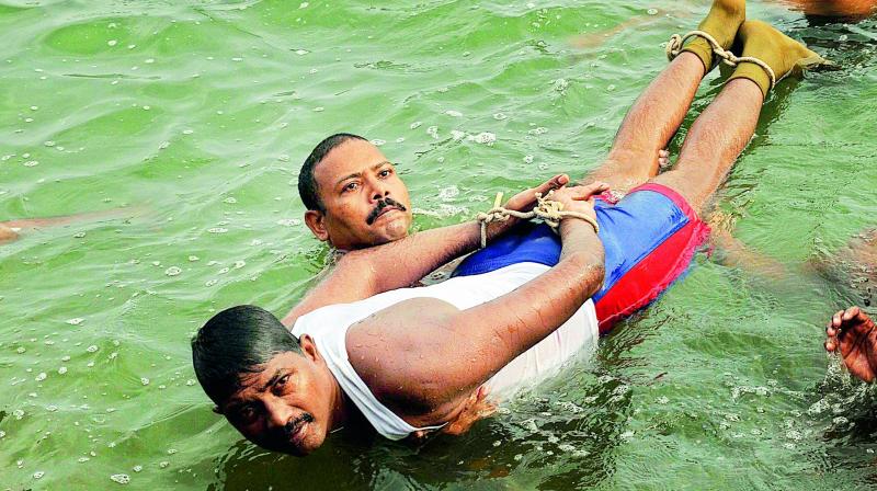 File photos of swimmer and constable L. Uma Maheswara Rao, who died in river Krishna at the practice time due to cardiac arrest in Vijayawada on Sunday. (Photo: DC)