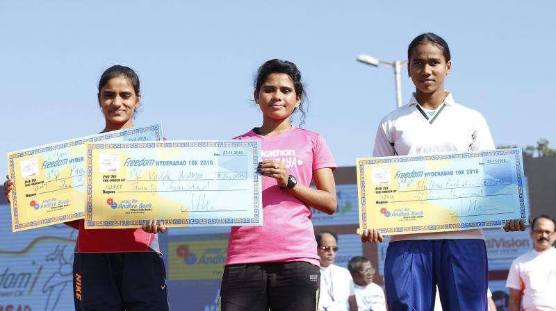 Priya Maloth (left), Vadde Navya (centre) and Shilpa Rachakonda pose with the cheques awarded to them in the Open female category.
