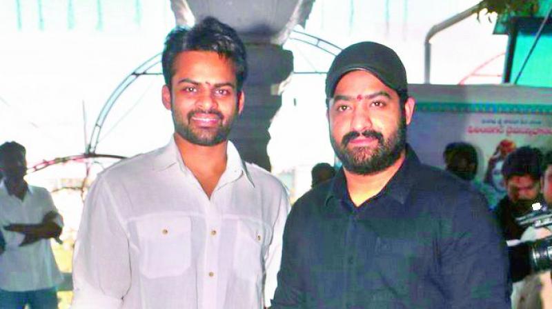 NTR Jr and Sai Dharam Tej share a light moment during the launch