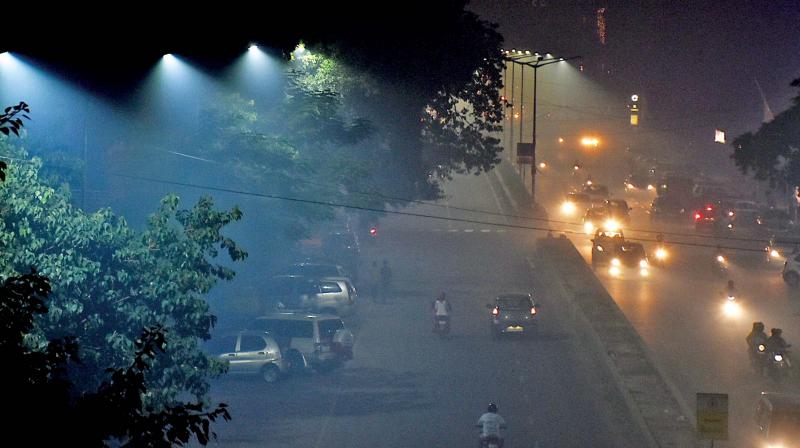 It is not a ride on the citys Anna Nagar flyover on a wintry night, but Chennaiites who travelled on Deepavali night had to encounter a veil of smoke from fire crackers that obstructed them from using the roads. (Photo: DC)