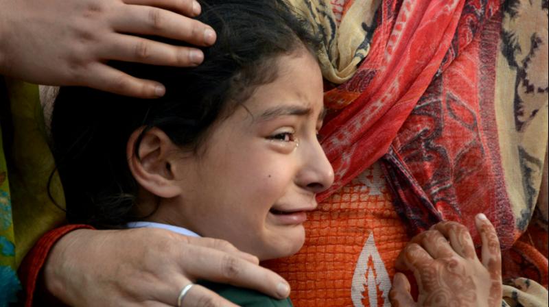 Zohra, daughter of deceased police officer Abdul Rasheed, who was killed in a shootout with suspected rebels, during the funeral at the police headquarters in Srinagar on Monday. (Photo: PTI)