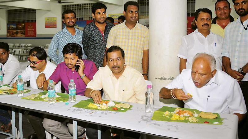 State BJP president B.S. Yeddyurappa has dinner after overseeing preparations being made for the two-day executive committee meeting of the party in Mysuru on Friday