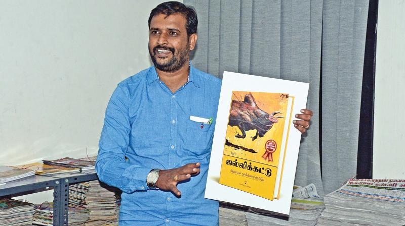 Saravanan Thyagarajan, with the cover of his book  Jallikattu-Arubadum Mookanangairu. (Photo: DC)