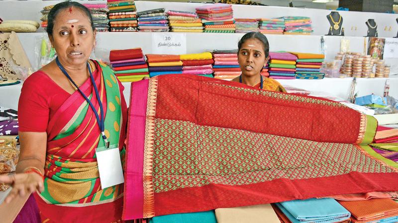 Weavers of Dindigul exhibit saris woven by them at Magalir Mela, at Mother Teresa womens complex,  in Valluvar Kottam.(Photo: DC)