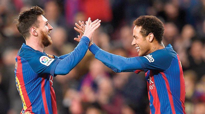 Barcelonas Lionel Messi (left) celebrates with team-mate Neymar after scoring against Celta Vigo. (Photo: AFP)
