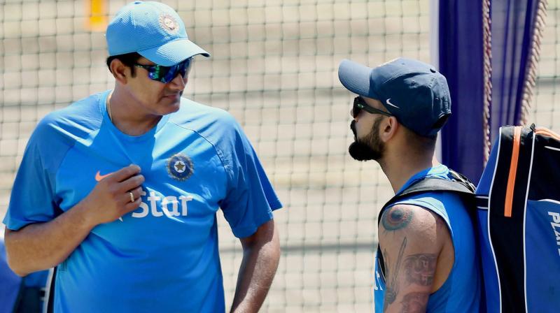 Even if there was any discomfort between the reportedly warring duo of Virat Kohli and Anil Kumble, it was not evident in their body language during the session. (Photo: PTI)