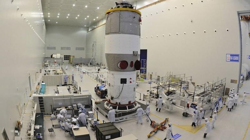This photo shows researchers testing Chinas first space station module Tiangong-1 at the Jiuquan Satellite Launch Center in northwest Chinas Gansu Province prior to its launch on September 29, 2011. (Photo: AP)