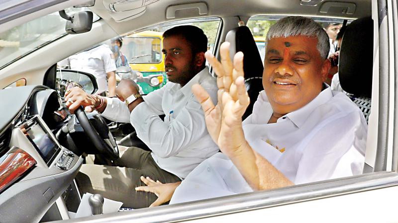 PWD Minister HD Revanna coming out after a meeting with CM HD Kumaraswamy and Congress leaders in Bengaluru on Tuesday (Photo: R. Samuel)