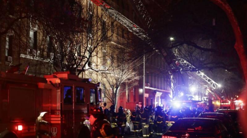 About 170 firefighters worked in bone-chilling cold, just 15 degrees, to rescue people from the building. Water sprayed from hoses froze into ice on the street. (Photo: AP)