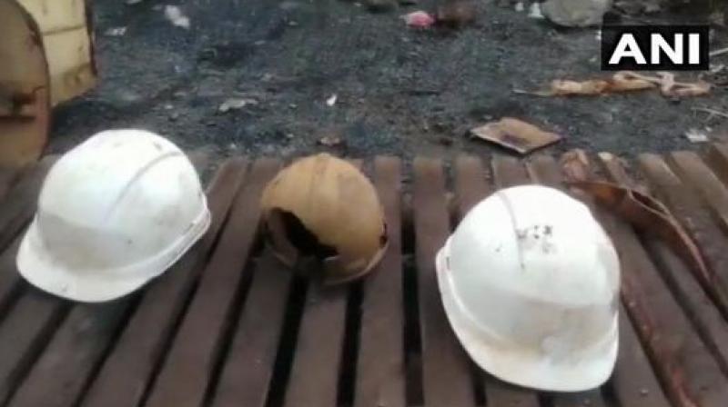 The rescuers recovered three helmets, which are suspected to be of the miners. (Photo: ANI)