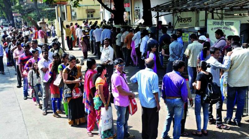A file picture of people waiting in a queue to withdraw money outside a bank in the city. (Photo: Deepak Kurkunde)