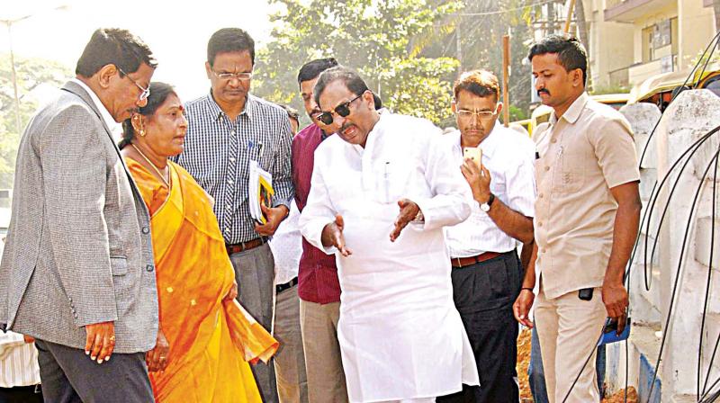 Bengaluru development minister K. J. George inspecting ongoing civic work at Palace Raod on Saturday. (Photo: DC)