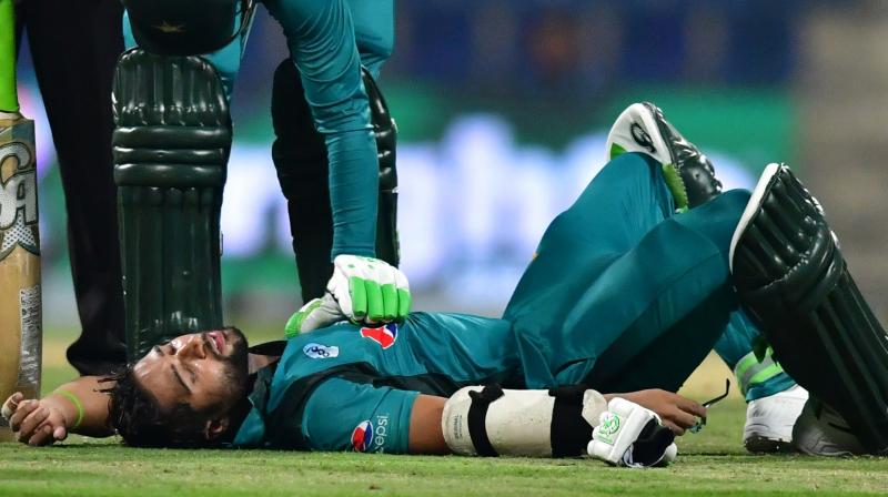 Imam-ul-Haq, on 16, was forced to retire after a short delivery from fast bowler Lockie Ferguson hit the grille of his helmet, making him dizzy before he fell to the ground during the second Pakistan versus New Zealand ODI. (Photo: AFP)