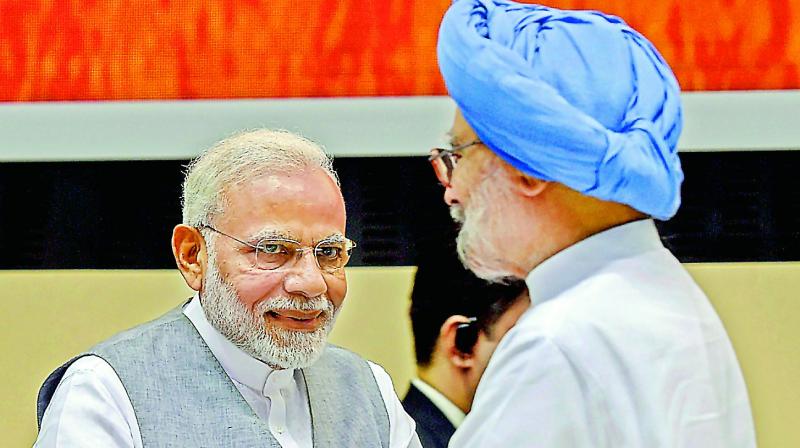 Prime Minister Narendra Modi and former prime minister Manmohan Singh during the book launch. (Photo: AP)