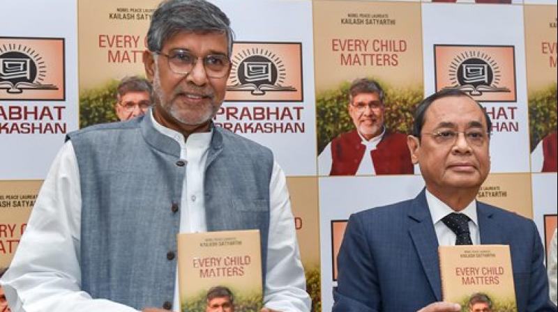 Justice Ranjan Gogoi releases the book Every Child Matters written by Nobel Peace Laureate Kailash Satyarthi at a function, in New Delhi. (Photo: PTI)
