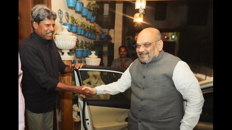 BJP president Amit Shah met cricket legend Kapil Dev as part of his partys contact for support campaign and shared the Prime Minister Narendra Modis governments achievements with him. (Photo: Twitter | @AmitShah)