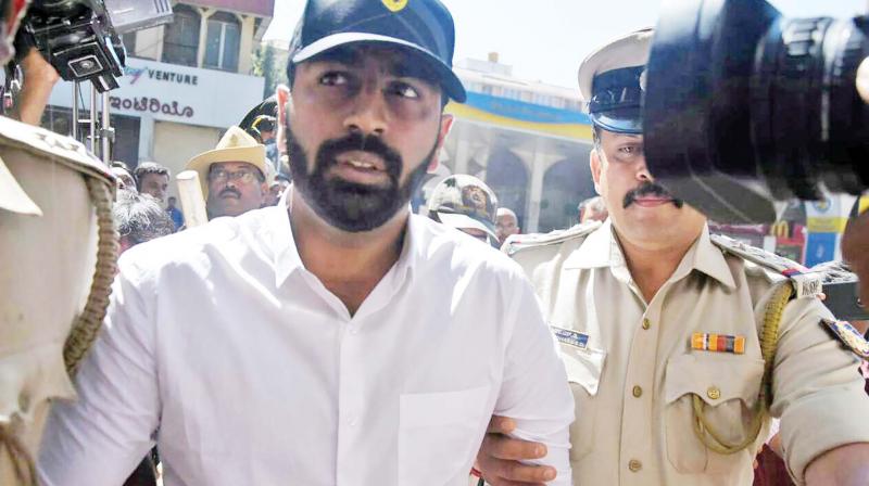 Mohammed Nalapad surrendering at Cubbon Park police station in Bengaluru on Monday. (Photo: DC)